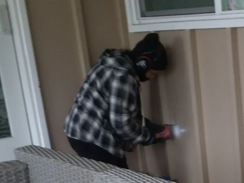 Professional electrician installing an exterior outlet in Reno