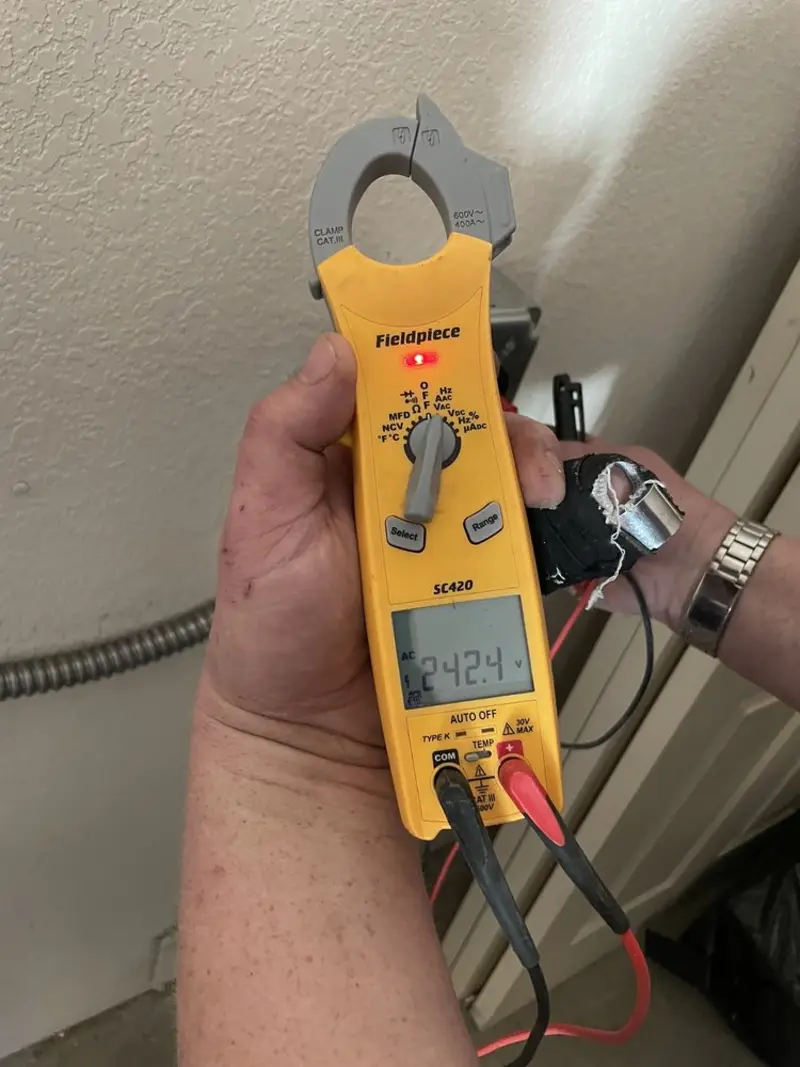 Voltage testing with clamp meter during Circuit Breaker Repair in Reno